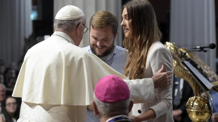 Pope Francis greets a couple at Saint Mary's Pro-Cathedral