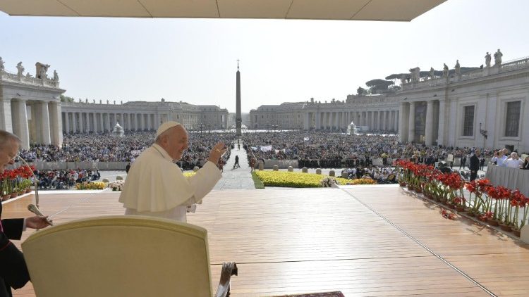 Pope Francis waves to pilgrims at the weekly General Audience