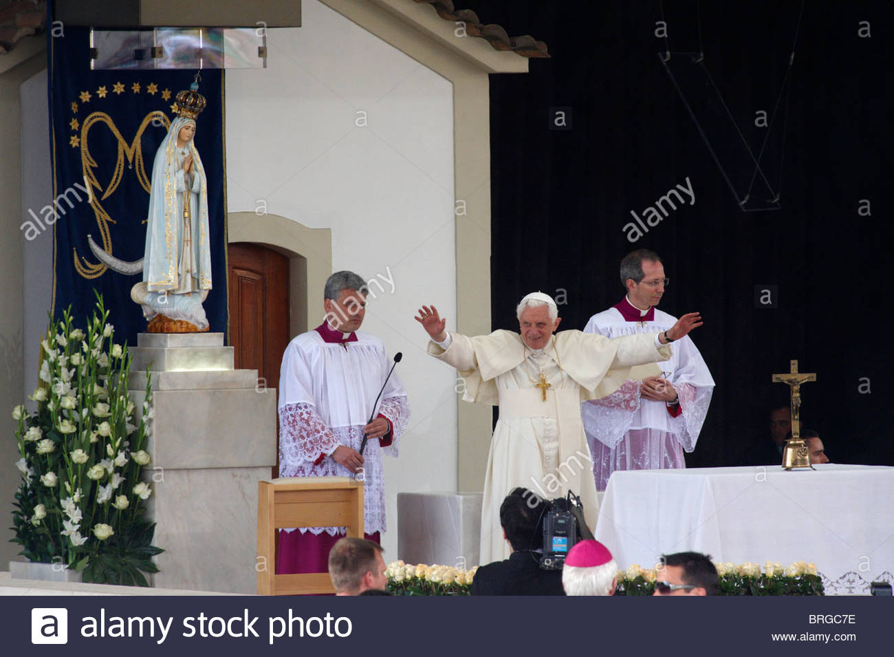 Pope Benedict XVI waves at pilgrims at the Our Lady of Fatima ...