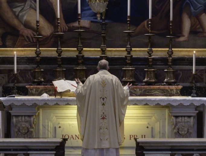 Pope Francis celebrates Mass at the tomb of St. John Paul II in St. Peter’s Basilica May 18, 2020. 