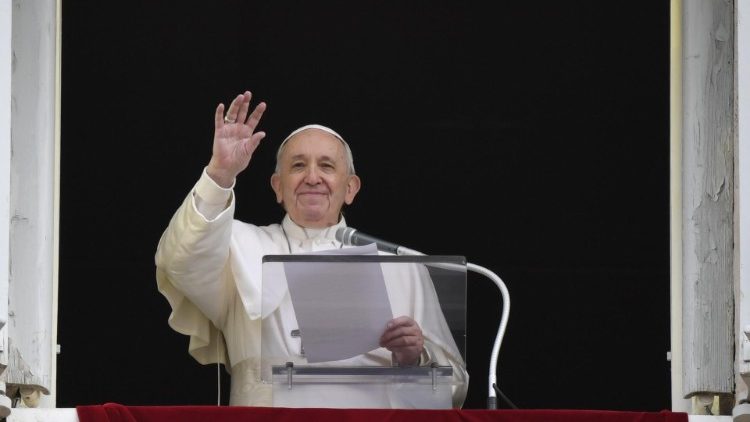 Pope Francis waves to the faithful at the Sunday Angelus
